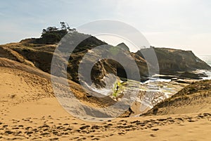 Mountain canyon. The gorge. Mountain river. Sand. Footprints in the sand. Blue sky and white clouds. Forest. Dark and pastel