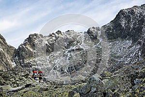 Mountain carriers walking to the mountain cottage, High Tatras mountains, Slovakia