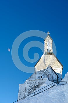 Mountain Chapel against a Deep Blue Sky