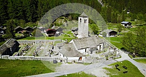 Mountain church in the italian alps aerial strafe left