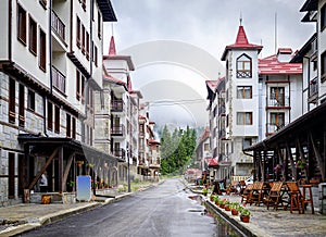 Mountain city with alpine architecture in rainy weather 1