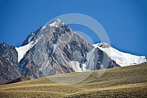 Mountain, cliffs, glaciers and snowfields in the Tien Shan photo