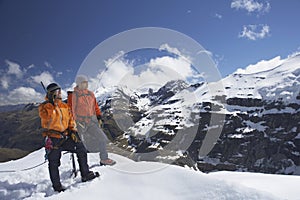 Mountain Climber Using Walkie Talkie By Friend On Snowy Peak photo