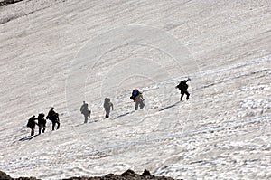 Mountain climbers climbing Mt Rainer