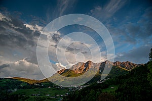 Mountain between clouds photo