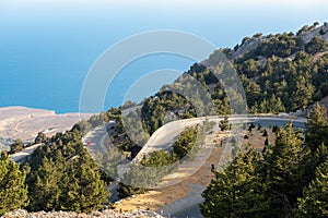 Mountain coast with serpentine roads at southern part of Crete island, Greece