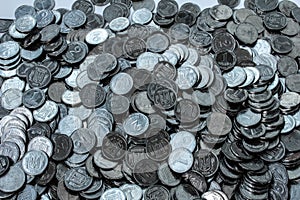 Mountain coins and coins in hand.