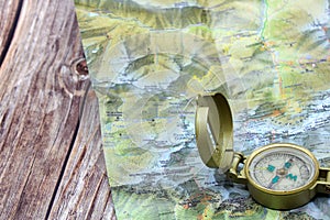 mountain compass on a cartographic map photo
