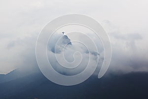 Mountain Corcovado with Christ the Redeemer in clouds and fog in