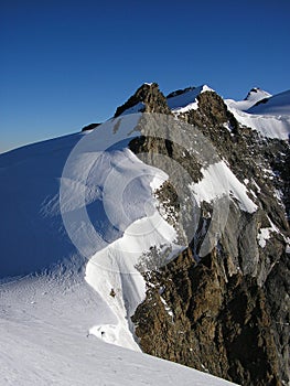 The Mountain Corno Nero in Wallis Alps Half Covered by Snow.