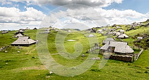 Mountain cottage hut or house on idyllic hill Velika Planina