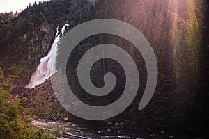 Mountain covered with dense forest and waterfall