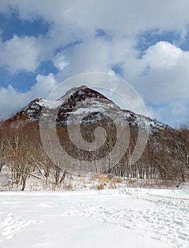 Mountain covered by snow backround in blue sky