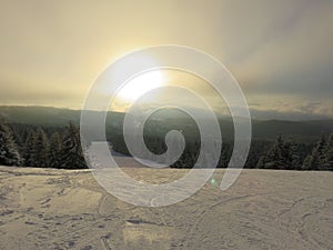 Mountain covered with snow in the faint winter sun landscape