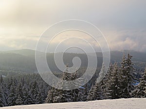 Mountain covered with snow in the faint winter sun landscape