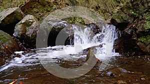 Mountain Creek. Water moves down through Rocks in the Mountains