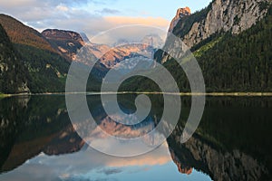 Mountain Dachstein,and Gossausee lake on sunset.