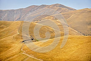 Mountain dirt road in autumn