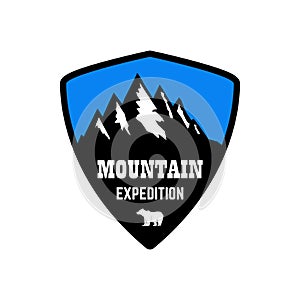 Mountain expedition. Emblem template with rock peak. Design element for logo, label, emblem, sign, poster.