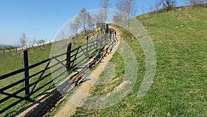 Mountain fence. Mountain rural road