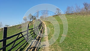 Mountain fence. Mountain rural road