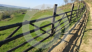 Mountain fence. Mountain rural road