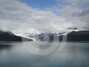 Mountain Filled horizon on the pacific ocean. Inside passage Alaska under a cloudy sky