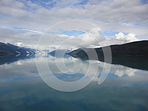 Mountain Filled horizon on the pacific ocean. Inside passage Alaska under a cloudy sky