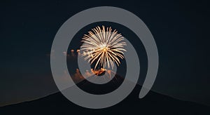 Golden Fireworks Exploding Over a Majestic Mountain at Night
