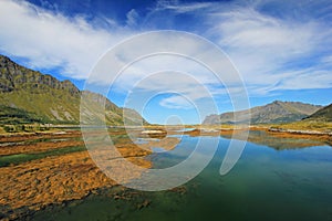 Mountain and fjord landscape, norwegian sea at Holandsmelen, Vestvagoy, Lofoten Islands, Norway photo