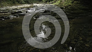 Mountain flowing creek stream. Creative. Stony path and flowing river.