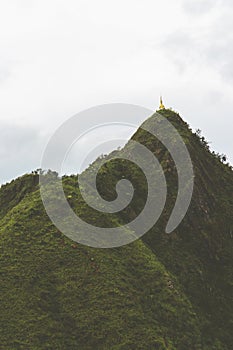 Mountain forest with white clouds  and blue sky of `LerGuaDa` or `Ler Gwa Dor` Tak province, Thailand, Asia. photo