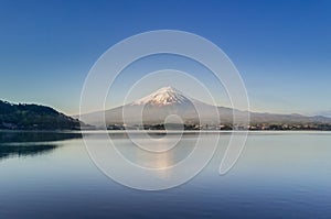 Mountain Fuji reflected in Kawaguchiko lake on a sunny day and clear sky