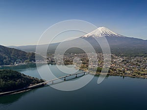 Mountain Fuji reflected in Kawaguchiko lake on a sunny day and clear sky