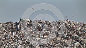 Mountain of garbage waste plastic bottles packages of rotting food