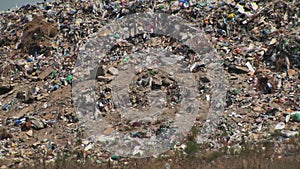 mountain of garbage waste plastic bottles packages of rotting food