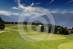 Mountain golf course in crans-montana photo