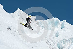 Mountain guide candidate training ice axe and rope skills on a glacier in the North Caucasus