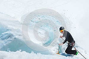 Mountain guide candidate training ice axe and rope skills on a glacier in the North Caucasus