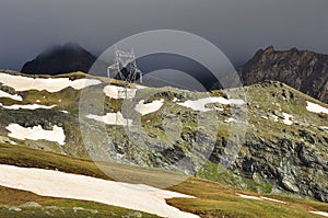 Mountain high voltage pylon, Italian Alps.