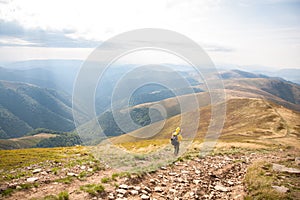 Mountain hiking tourism. Woman hiker summer day in a beautiful