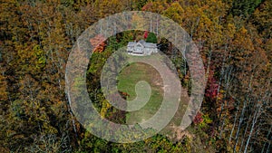 Mountain home aerial view in autumn