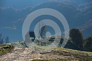 Mountain homestead in the autumn. Countryside thatched roof houses, barn