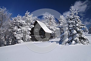 Mountain house in snow