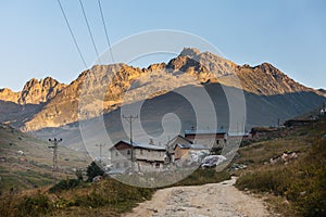 Mountain houses with clouds in Ayder Plateau, Rize, Turkey