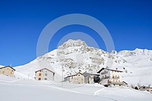 Mountain houses and snowy peaks