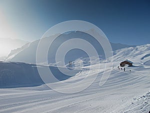 Mountain hut on ski slope photo