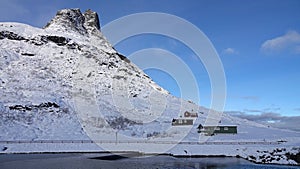 Mountain huts near Visitor centre on Trollstigen road in snow in Norway in autumn