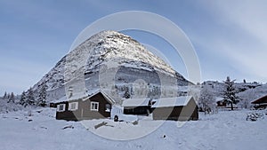 Mountain Huts on Trollstigen road in snow in Norway