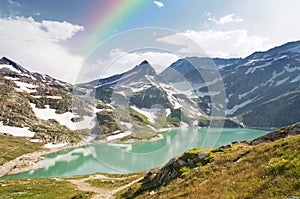 Rainbow over mountain lake in alps, Austria